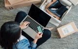 Young Woman Shopping Online While Relaxing At Home