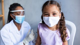 Covid-19 Vaccine - Child being vaccinated