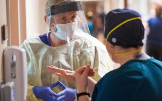 Registered nurse Katie Katie (L) talks with a fellow nurse inside the Covid-19 ICU (Intensive Care Unit) at Adventist Health in Sonora, California on August 27, 2021.