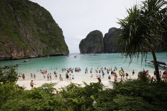 Tourists at Maya Bay in Thailand before its closure in 2018. It has reopened with restrictions. 