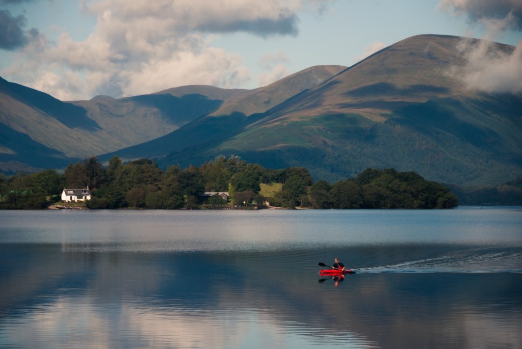 man paddling a kyak in Scotland