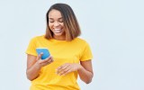 A woman looking at a mobile phone.