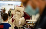 Pictured is Santa wearing a face mask