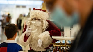 Pictured is Santa wearing a face mask