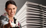 Pictured is Jacinda Ardern and a stack of papers to illustrate a shift towards plain language
