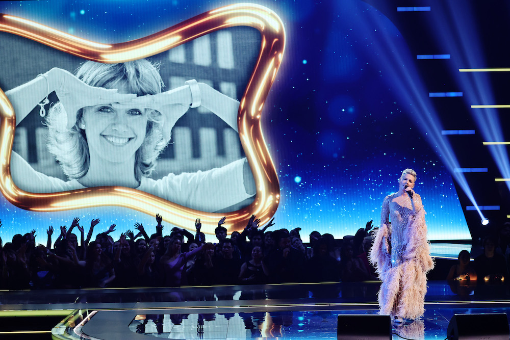 Pictured is Pink paying tribute to Olivia Newton-John