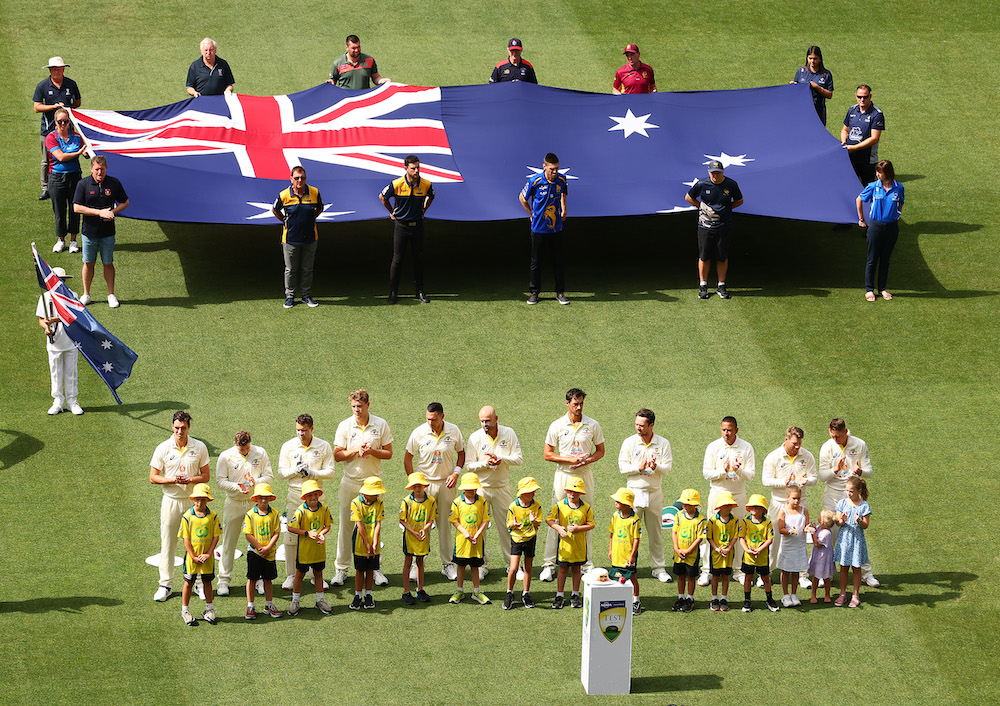 Australia take part in a tribute to Shane Warne during day one of the Second Test match in the series between Australia and South Africa at Melbourne Cricket Ground