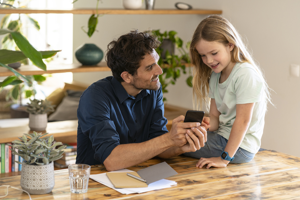 pictured is a child and their parent talking.