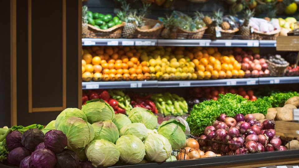 pictured are the produce aisle at the supermarket, illustrating food waste.