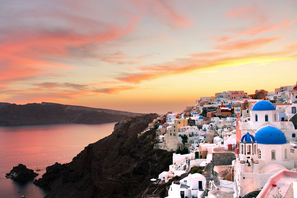 pictured is a sunset in Santorini