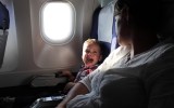 pictured is a screaming child on a flight