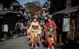 Japanese women dressed as Geisha and Maiko by Maiko Shiki Studio walk on Higashiyama district in Kyoto, Japan on December 05, 2016.