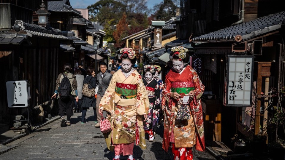 Japanese women dressed as Geisha and Maiko by Maiko Shiki Studio walk on Higashiyama district in Kyoto, Japan on December 05, 2016.